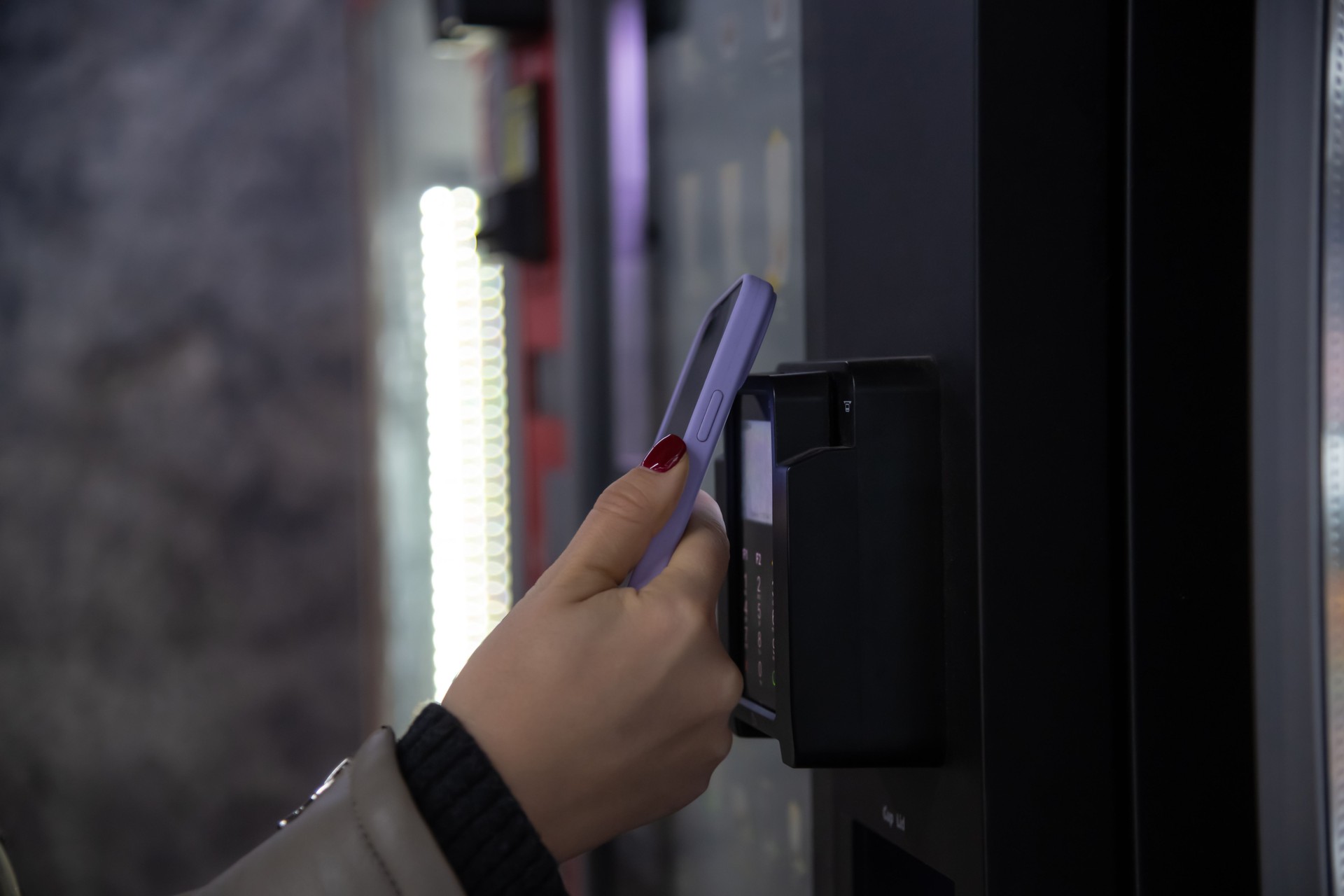woman paying for purchase using smartphone